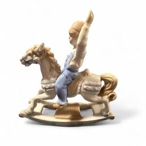 Paul Sebastian porcelain figurine of a boy on a rocking horse, dated 1991